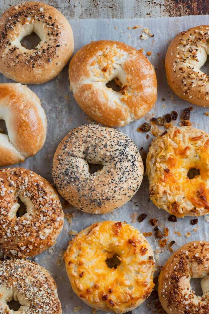 Top-down view of a variety of freshly baked bagels, golden brown and crispy