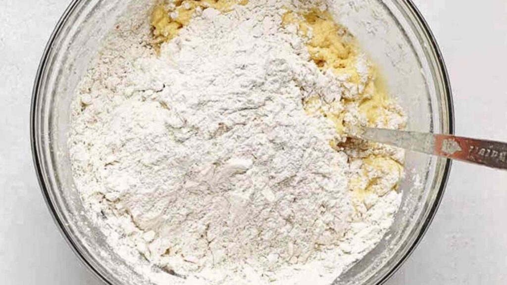 Mixing Flour into Bagel Dough