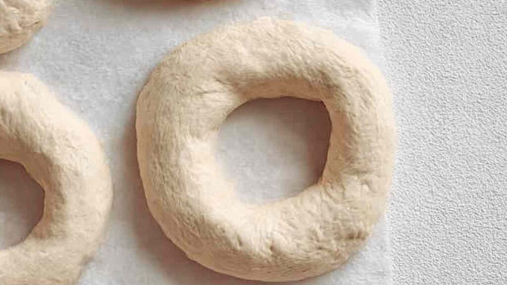 Unbaked Sesame Bagel Shapes