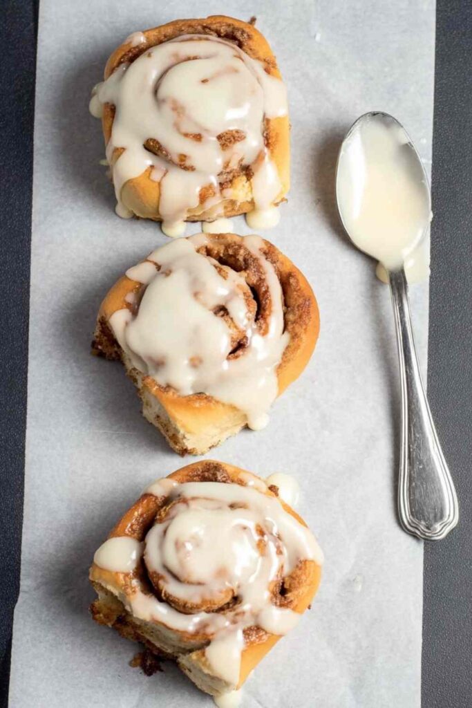 Glazed Cinnamon Rolls on Parchment