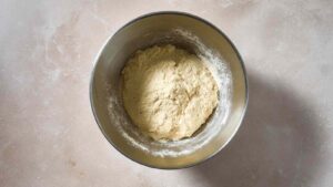 Bowl of bagel dough after initial mix, made with sourdough discard and Greek yogurt