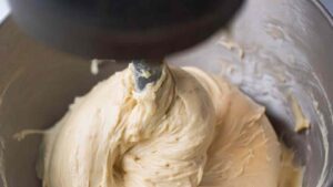 Smooth, elastic sourdough cinnamon roll dough wrapped around mixer hook
