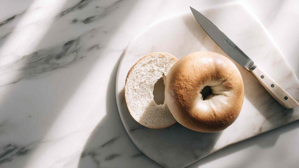 Perfect Air Fryer Toasted Bagels 8 air fryer toasted bagel sliced on marble board