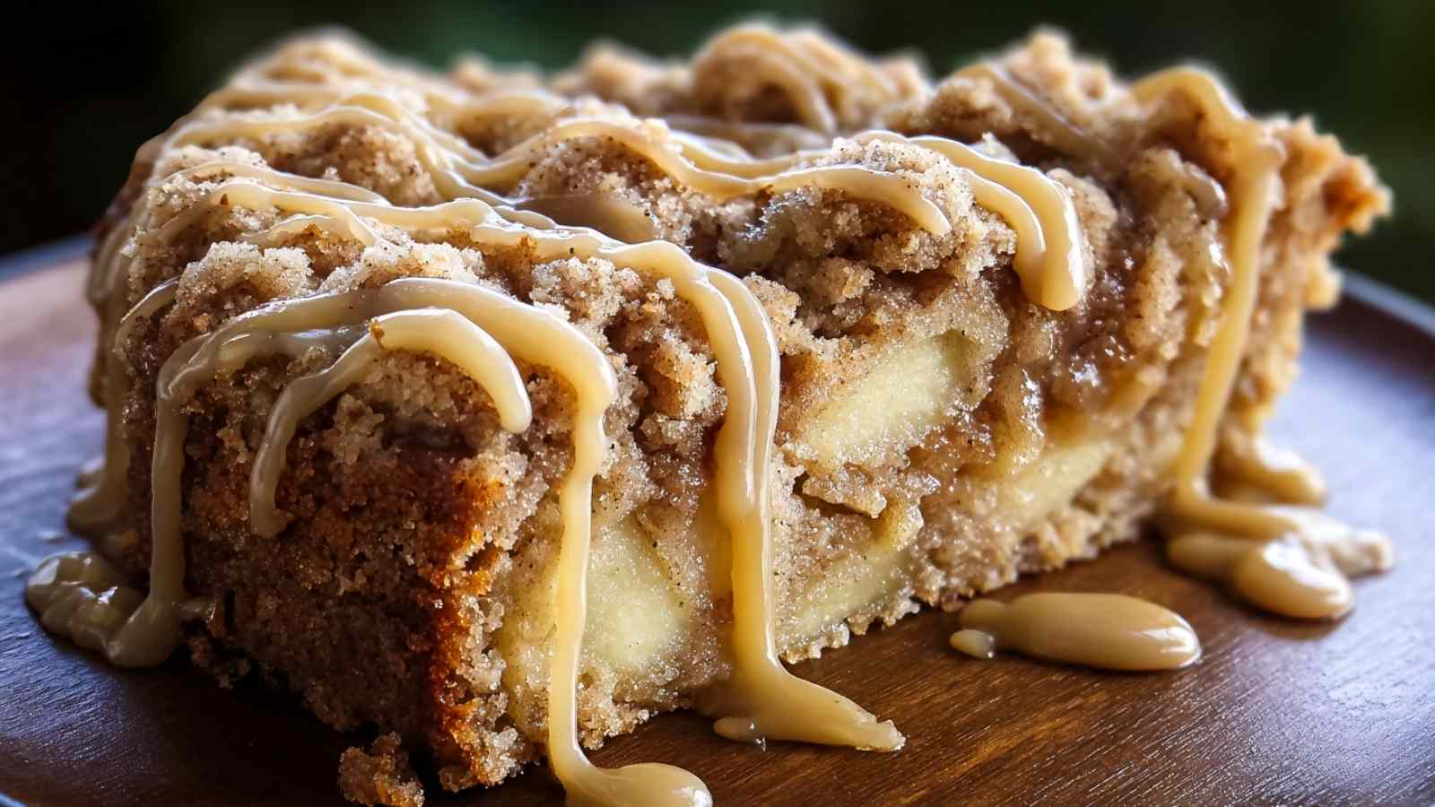 Apple Crumb Cake with Cinnamon Apple Drizzle slice on white plate showing crumb topping and drizzle