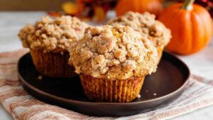 Apple pumpkin streusel muffins with golden tops and visible apple pieces