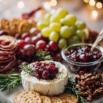 Close-up of brie cheese topped with cranberries and rosemary on marble board, with crackers and festive lights in background