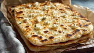 cottage cheese flatbread on baking sheet golden brown edges