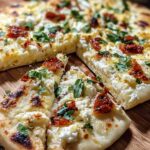 cottage cheese flatbread on parchment paper golden brown edges