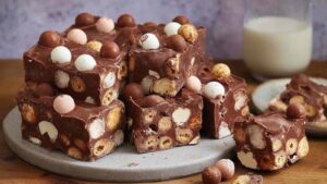 Rich chocolate rocky road packed with Maltesers, marshmallows and biscuits. No baking required - just 4 hours to set! Perfect for parties and gifts.