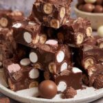 Rich chocolate rocky road packed with Maltesers, marshmallows and biscuits. No baking required - just 4 hours to set! Perfect for parties and gifts.