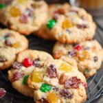 Easy Christmas Fruitcake Cookies with red and green candied cherries on cooling rack