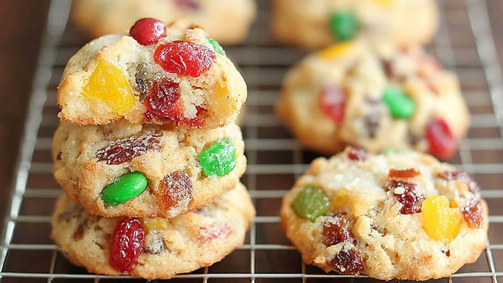 Easy Christmas Fruitcake Cookies with red and green candied cherries on cooling rack