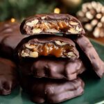 Easy Christmas Pecan Turtles arranged on white plate with holiday decorations