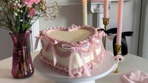 Elegant Pink Rosette Ribbon Cake Recipe That Will Steal the Show Elegant pink rosette ribbon cake with buttercream flowers and satin bows