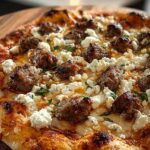 Hot Sausage Feta Honey Pizza with melted cheese and honey drizzle