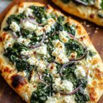spinach and feta flatbread pizza fresh from oven with melted cheese