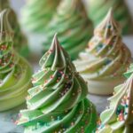 Christmas Tree Meringues being piped with star tip showing tree shape technique