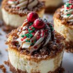 Mini Christmas cheesecakes with red and green sprinkles on white plate