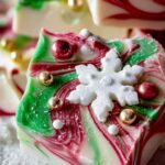 White chocolate Christmas bark with red and green swirls and holiday sprinkles
