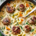 Swedish meatball soup in white bowl with creamy broth and tender meatballs