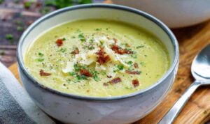 Mediterranean Orzo Soup Mediterranean orzo soup in white bowl topped with fresh basil and parmesan cheese