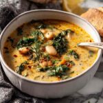 Creamy Pumpkin Black Bean Soup in a bowl topped with fresh cilantro