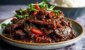 Crispy Chilli Beef crispy chilli beef with peppers and onions in sweet spicy sauce
