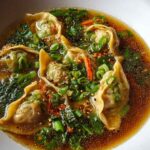 Bowl of Asian Potsticker Soup with ginger broth and dumplings