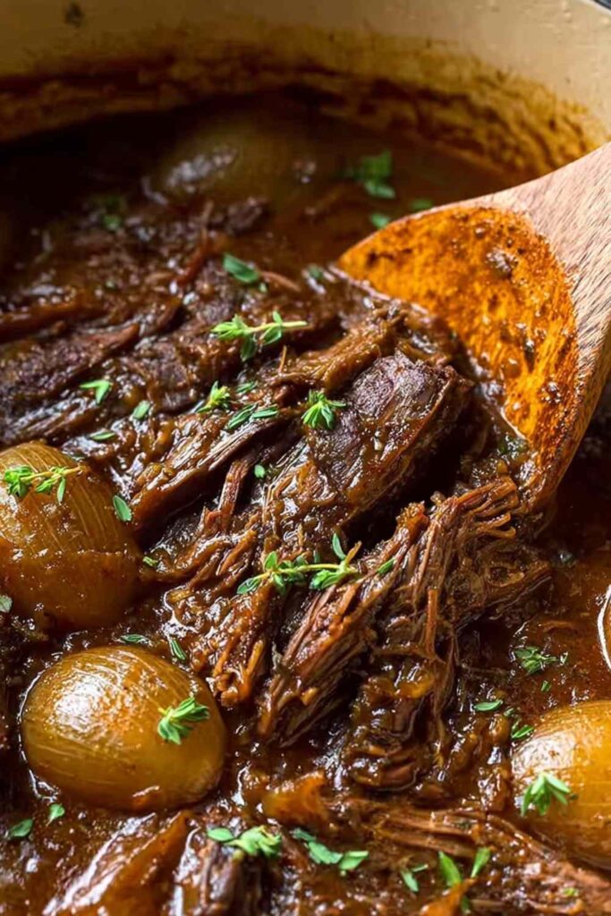 French Onion Pot Roast with caramelized onions in Dutch oven