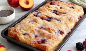 Homemade Jam Donut Focaccia dusted with powdered sugar on cooling rack