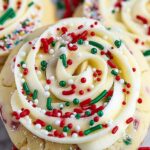 Soft cake batter cookies with rainbow sprinkles and white chocolate chips on cooling rack