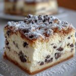 Cannoli cheesecake bars with chocolate chips and pistachios on white plate