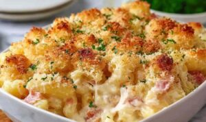 Chicken Cordon Bleu Casserole with golden panko topping in white baking dish