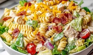 Club Sandwich Pasta Salad in large bowl with bacon chicken and vegetables
