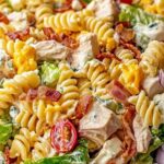 Club Sandwich Pasta Salad in large bowl with bacon chicken and vegetables