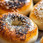 Easy sourdough bagels with everything seasoning on cooling rack, golden brown and freshly baked