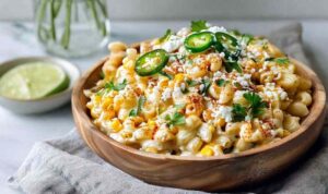 Perfect Mexican Street Corn Pasta Salad Perfect Mexican Street Corn Pasta Salad in white bowl with cotija cheese and cilantro garnish