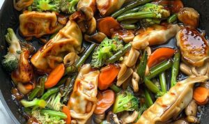 Potsticker stir fry with crispy dumplings and colorful vegetables in skillet