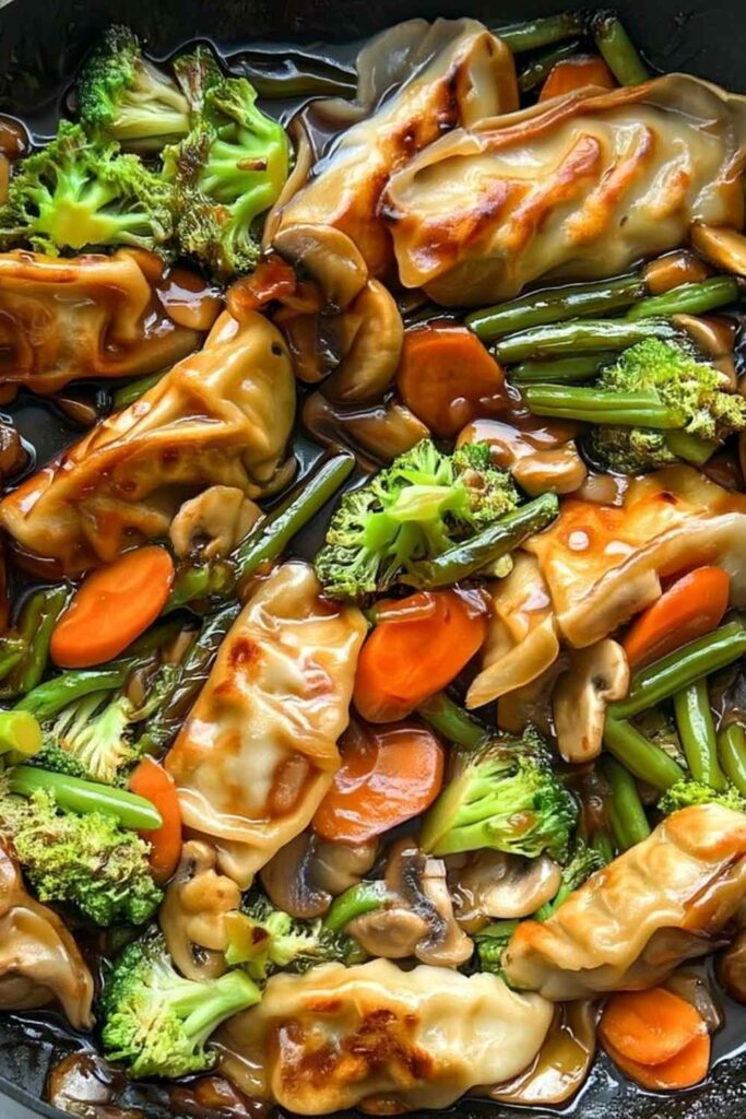 Potsticker stir fry with crispy dumplings and colorful vegetables in skillet