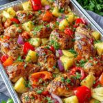 Sheet Pan Hawaiian Chicken with Pineapple and colorful bell peppers on baking sheet