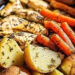 Slow cooker garlic butter chicken and veggies with potatoes and green beans in white bowl