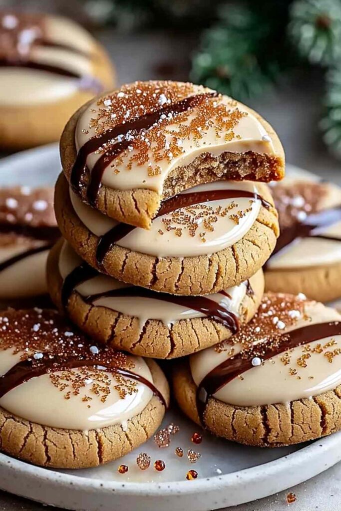 White Chocolate Dipped Chewy Maple Cookies on cooling rack with half dipped in white chocolate
