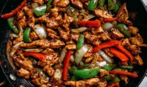 Black Pepper Chicken Recipe: Bold Chinese Stir-Fry Black pepper chicken stir-fry in wok with vegetables and savory sauce