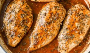 Brown sugar garlic chicken on white plate with glossy caramelized glaze and rice