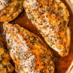 Brown sugar garlic chicken on white plate with glossy caramelized glaze and rice