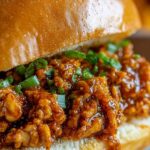 Cajun Chicken Sloppy Joes on toasted buns with thick spicy tomato chicken filling