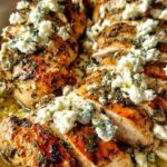 Greek chicken lemon feta recipe served in a skillet with fresh dill and parsley