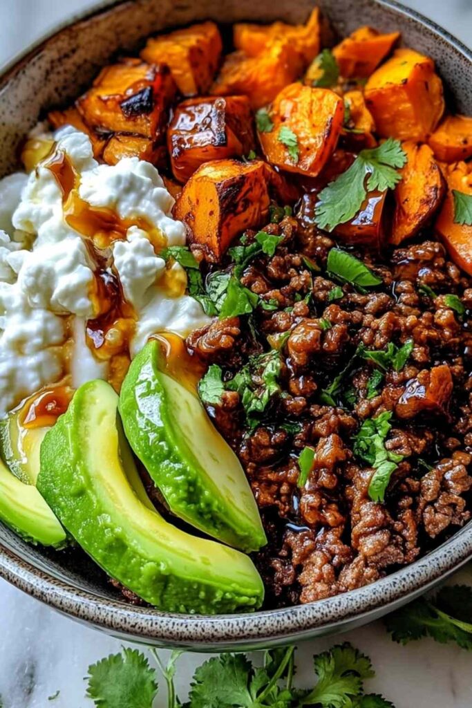 Ground Beef Hot Honey Bowl - Sweet, Spicy High-Protein Dinner 6 Ground Beef Hot Honey Bowl with rice, avocado, and cilantro in a white bowl