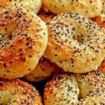 High protein bagel bites on baking sheet with everything bagel seasoning