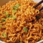 High protein vegan ramen noodles in a bowl with crispy tofu, bok choy, mushrooms, and savory miso broth